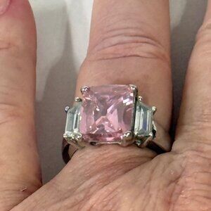 Sterling silver and pink princess cut stone ring.